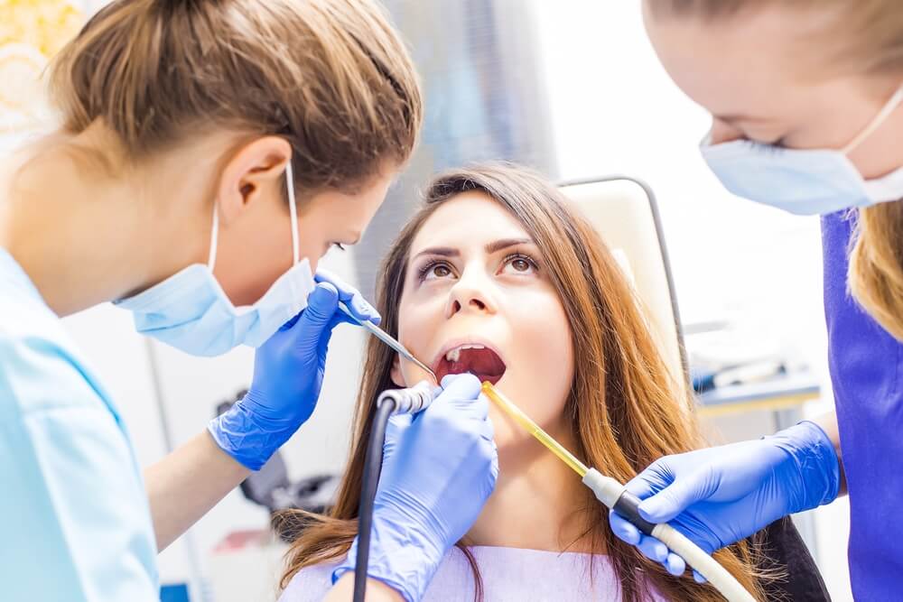 Dental patient getting teeth cleaned